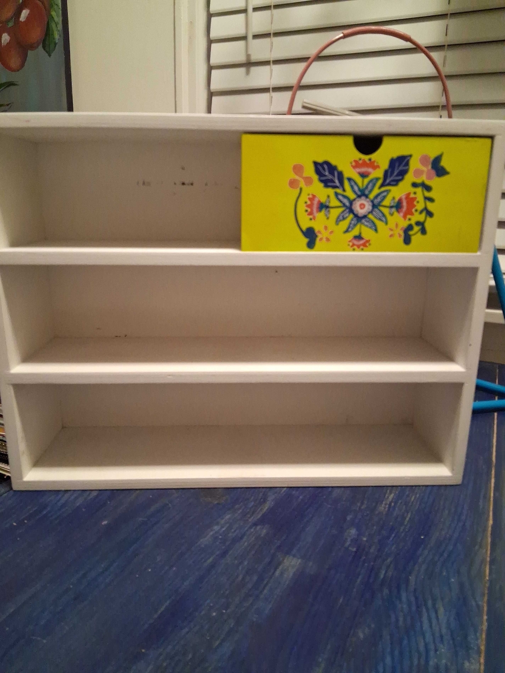 White Wooden Multi-Shelf Organizer with Decorative Yellow Drawer